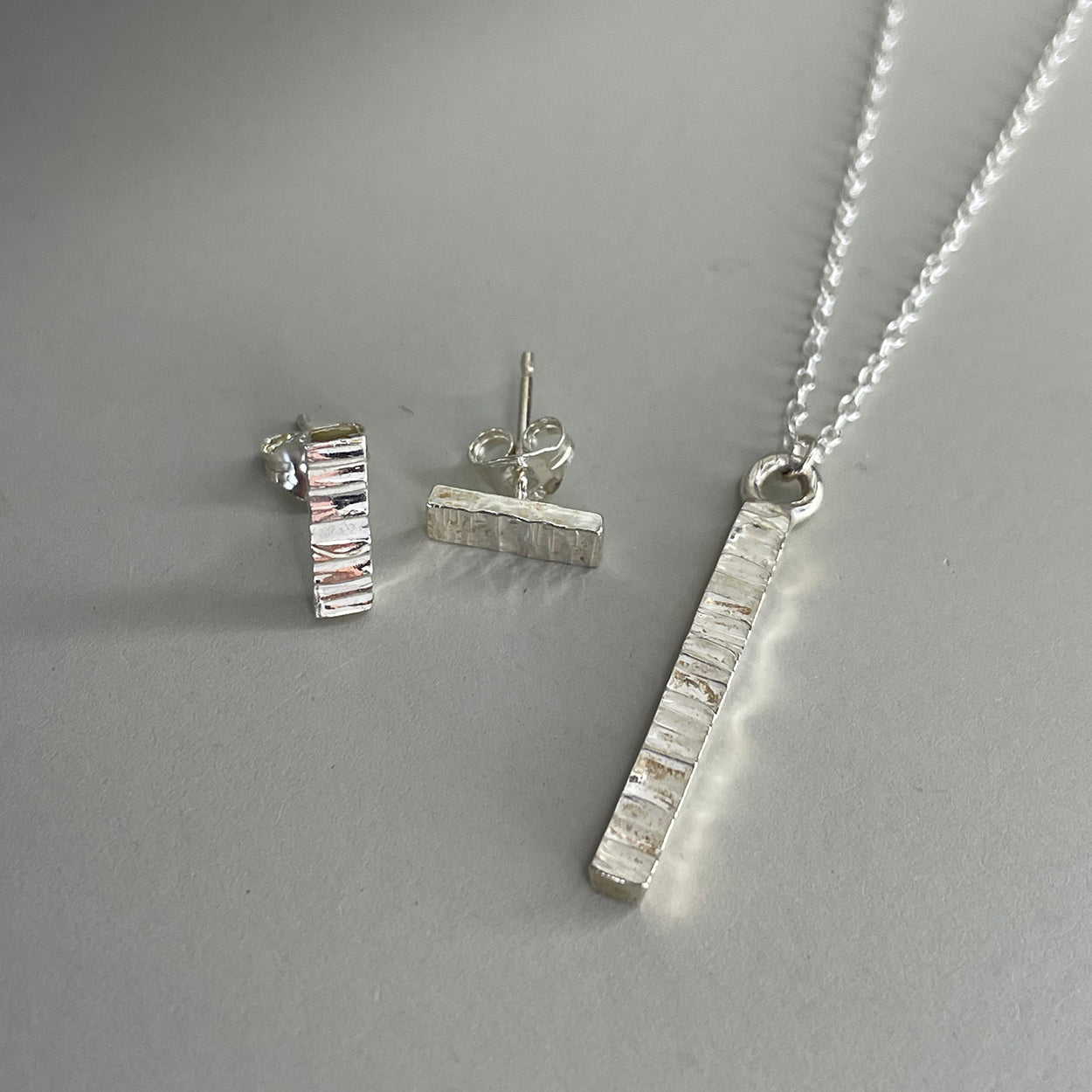 Sterling silver tiny bar hammered bark texture post earrings